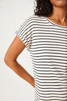 Close-up of a women's black and white striped knit t-shirt showcasing the soft textured fabric, round neckline, and rolled short sleeve detail with subtle metallic yarn accents.