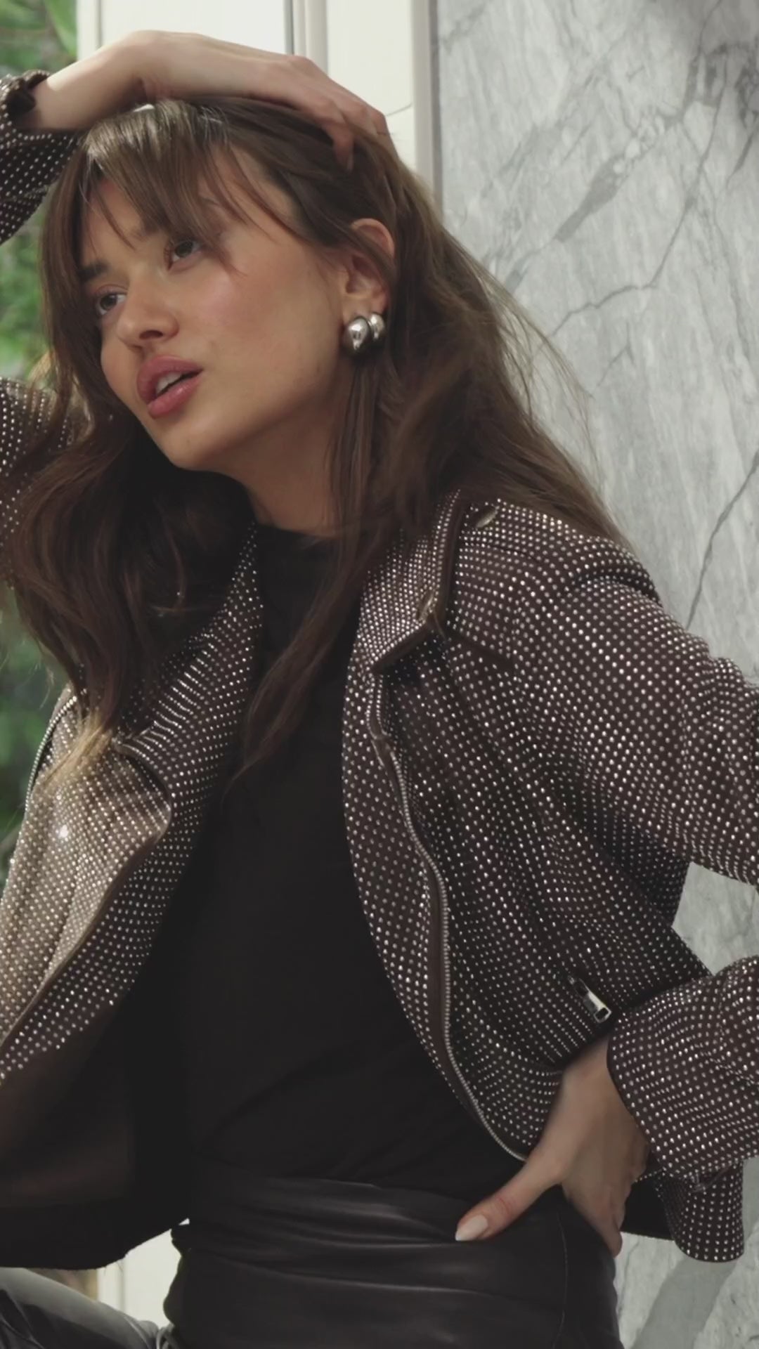 woman wearing brown studded moto jacket 